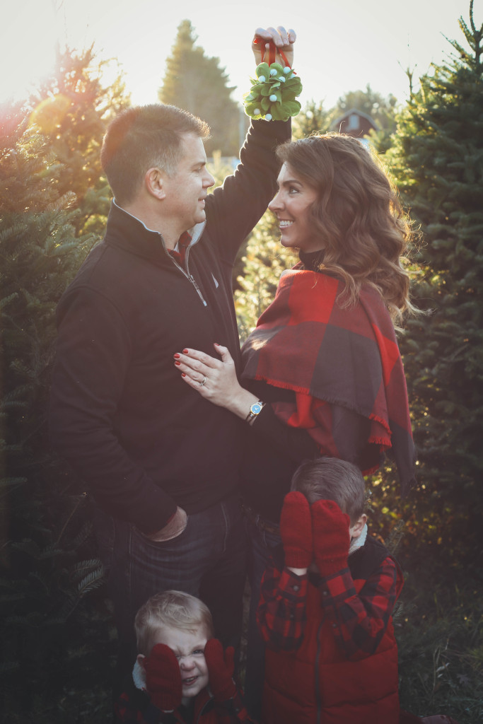 Merry Christmas family pictures 2017 - From the Family With Love - buffalo check family outfits, red Hunter boots, mistletoe, red mittens, tree farm, red vests, buffalo plaid scarf