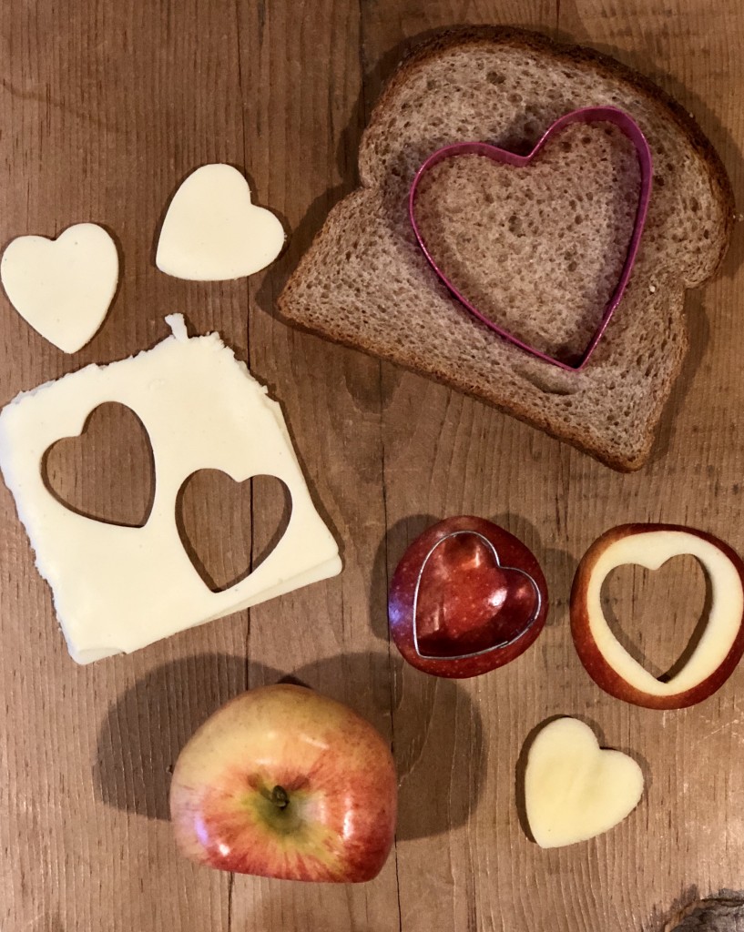 Lunchbox Refresh with My Hannaford Rewards - veggie sticks, apples, carrot sticks, heart cut out sandwich, heart cut out apples, blueberries, mini water bottle, lunchbox napkin note - From the Family With Love