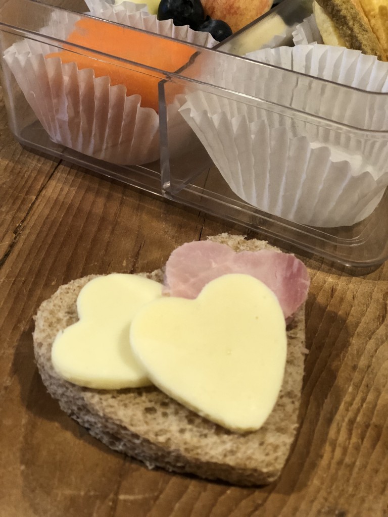 Lunchbox Refresh with My Hannaford Rewards - veggie sticks, apples, carrot sticks, heart cut out sandwich, heart cut out apples, blueberries, mini water bottle, lunchbox napkin note - From the Family With Love