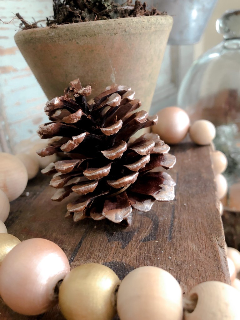 DIY Festive Painted Wood Bead Strand - Potting Table Farmhouse Christmas decor - Christmas Potting Table - Martha Stewart Metallic Rose Gold Paint, Martha Stewart glitter paint, Martha Stewart Gold Paint