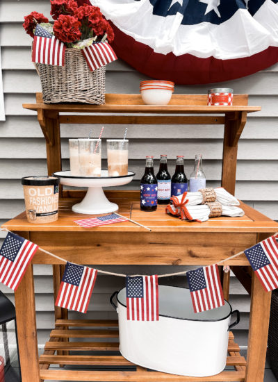 quart of vanilla ice cream with root beer float and American flag banner and patriotic labels on root beer bottles