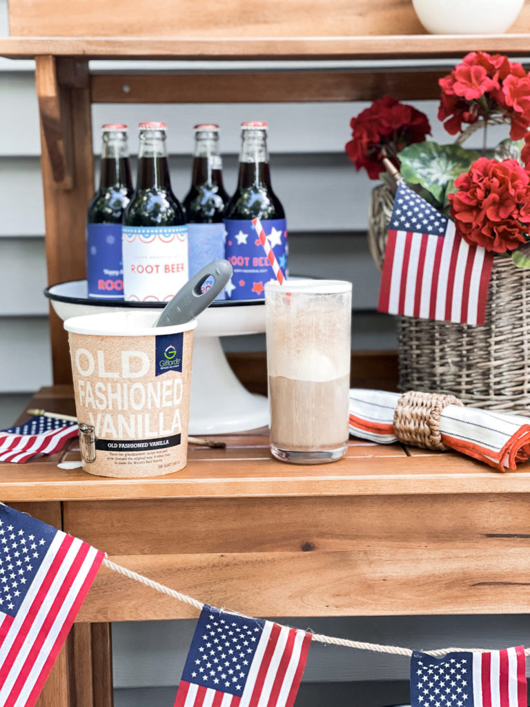 quart of vanilla ice cream with root beer float and American flag banner and patriotic labels on root beer bottles